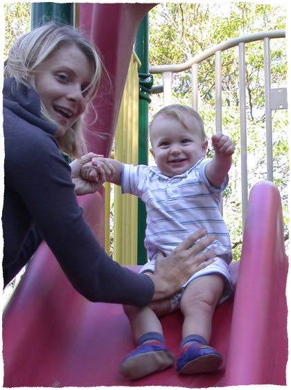 Simon on the slide with Mom