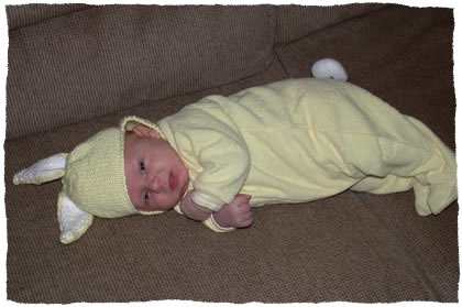 Simon in a bunny suit trying to hop away